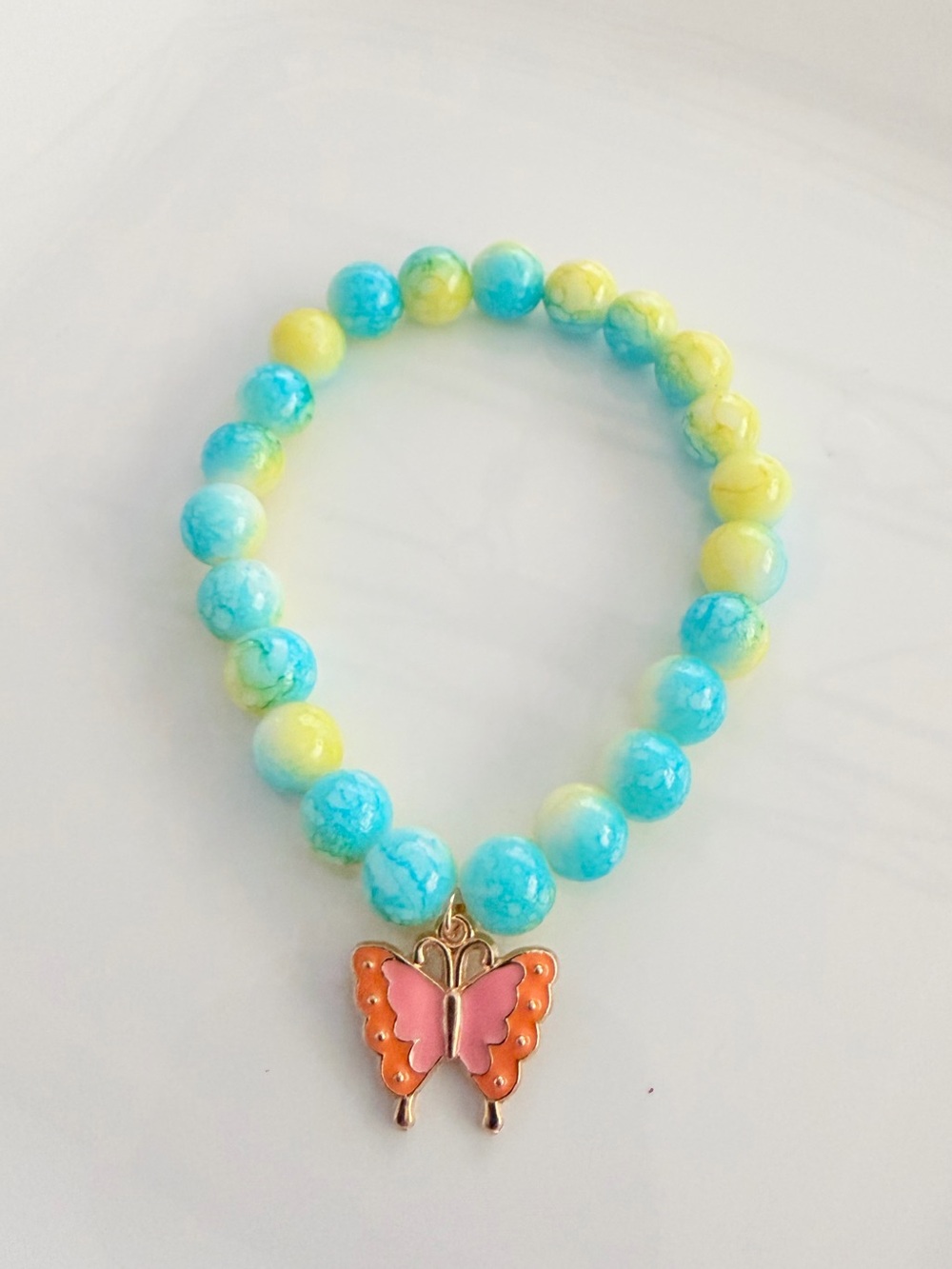 Turquoise & Yellow Beaded Bracelet with Pink Butterfly Charm